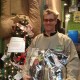 Billy Stalker, IHH employee, with the Angel Tree and some bags of food that were donated.