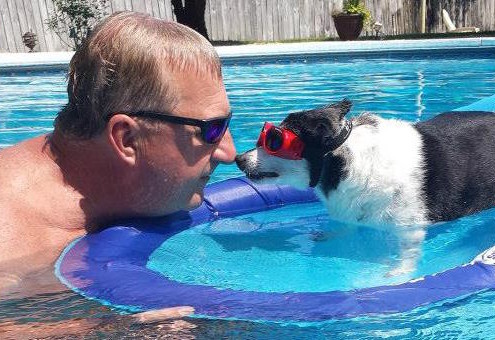 Dad and Octavia, playing in the pool
