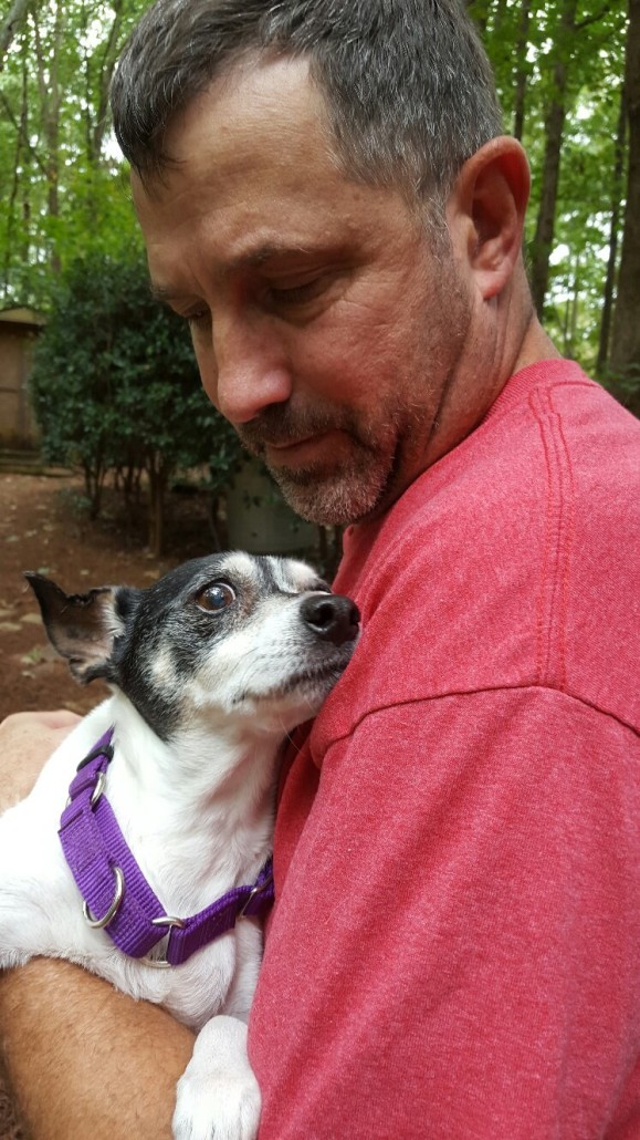 Roxy spending her last few days in the arms of her loving foster daddy, Larry/