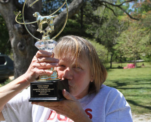 Mama Donna kissing Wag-a-Lot award